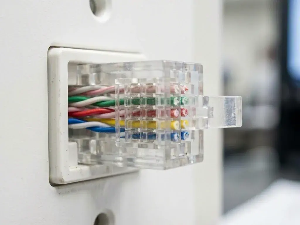 Technician tracing a dead outlet circuit in a finished room