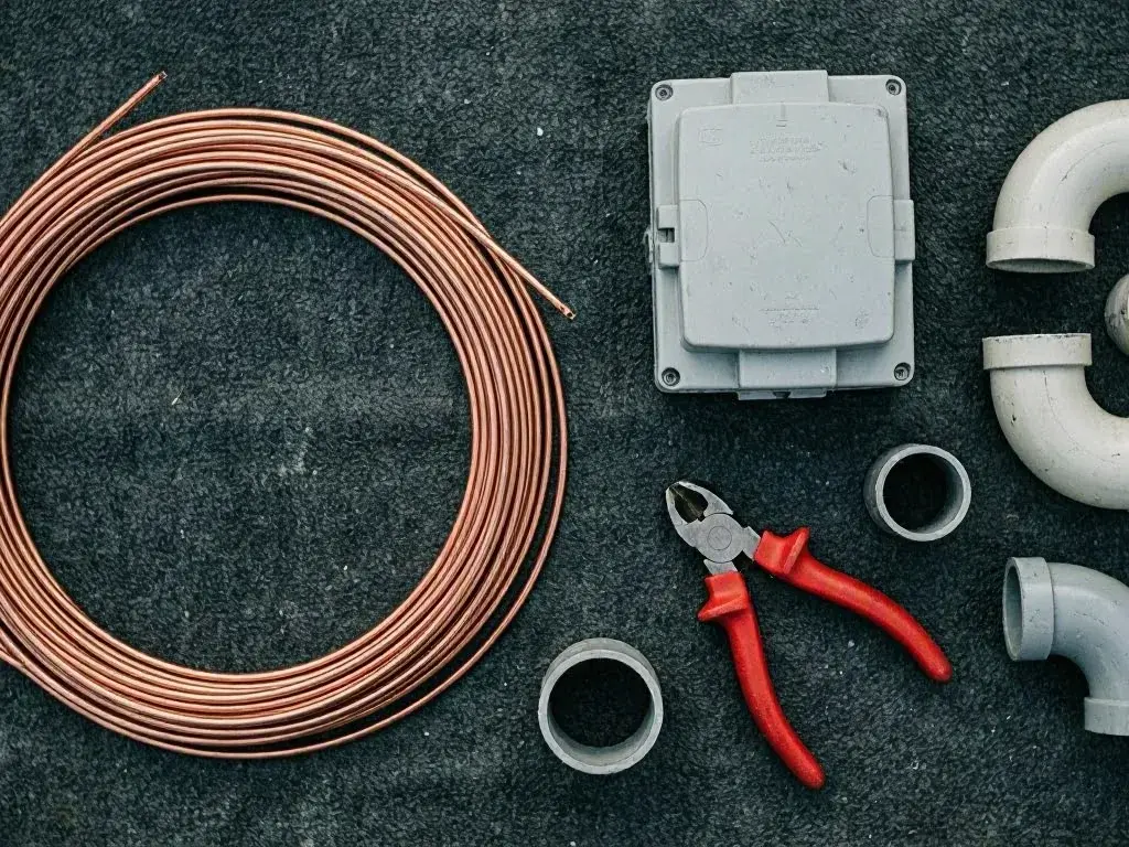 Wiring inspection at a pool pump by a brick home